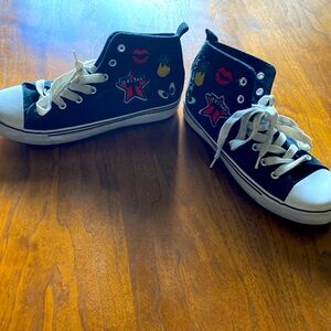 Black & white high tops tennis shoes, decals on side, pineapple lips,eyes size 7